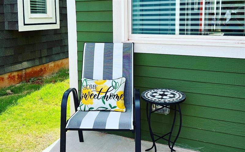 A chair on a porch of a Pivot tiny home.