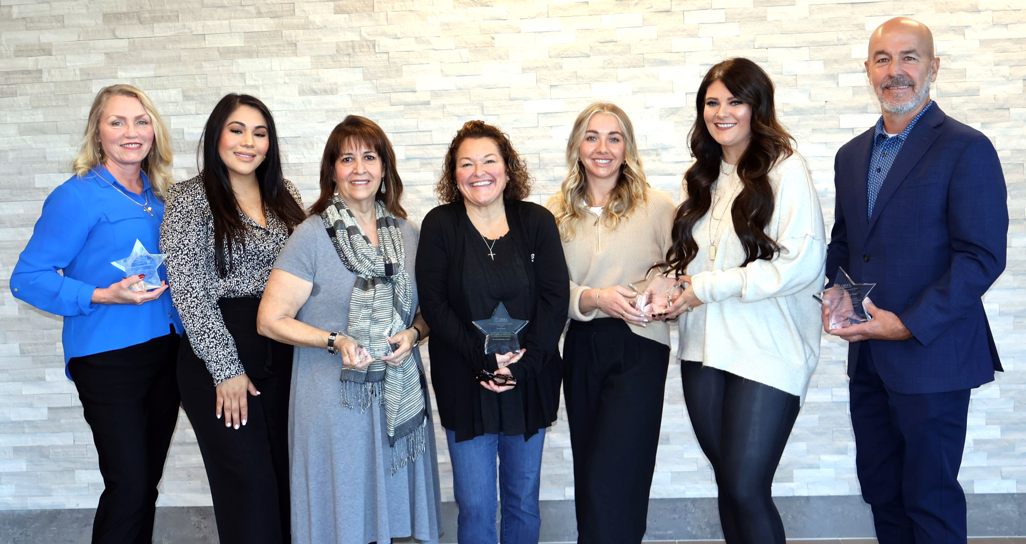 Oklahoma Housing Finance Agency's 2023 Leading Light Lending Partner award recipients include, from left, Shannon Kurtz and Yahaira Velasco, AMC/Associated Mortgage Corp.; Alba Santiago, Gateway Mortgage Group; Barb Yeary, Stride Bank; Cheyenne Buckley and Chelsea Stanford, Great Plains National Bank; and Darren Vittitow, First United Bank & Trust.