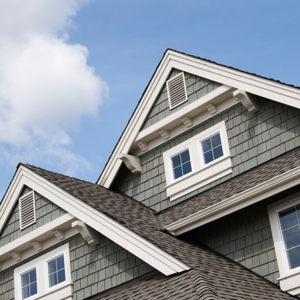 A house with gray gables against a blue sky