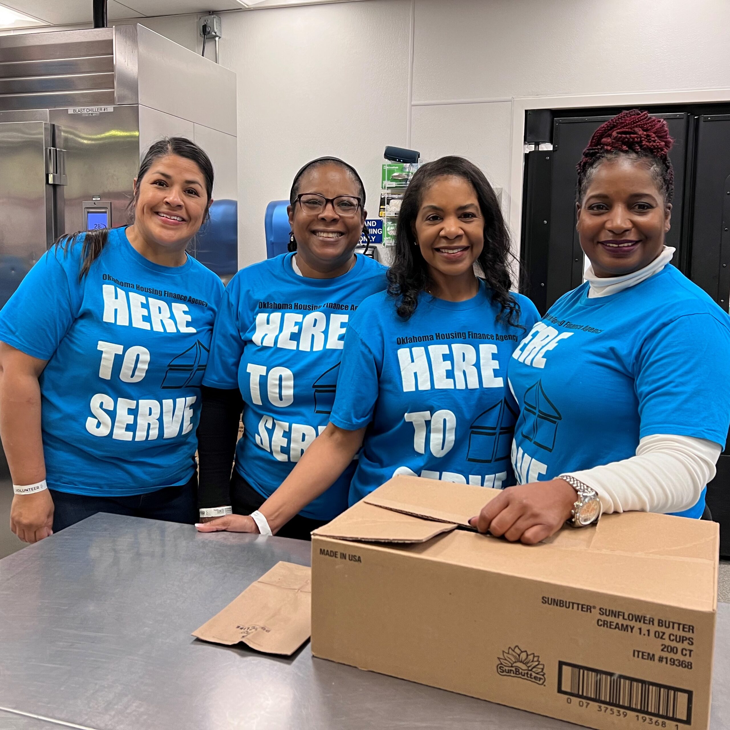 Deborah Jenkins, executive director, joins fellow staff members for OHFA Gives Back Day at the Regional Food Bank of Oklahoma. From left, Rosa, Valenthia, Deborah, and Kathy.