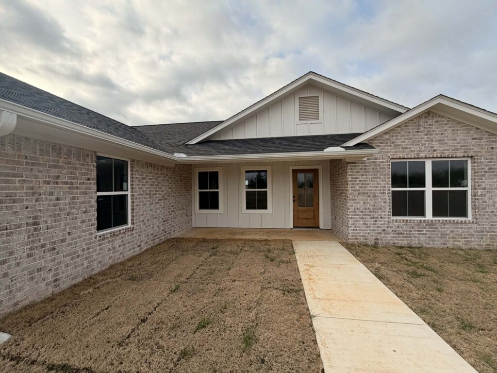 The exterior view of a brick home built by LIFT Community Action Agency in Hugo.