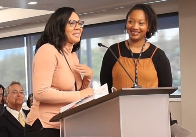 Brittany, a graduate of the Family Self-Sufficiency program, addresses members of the Board of Trustees. She is joined by Lanisha Hines, OHFA FSS specialist.