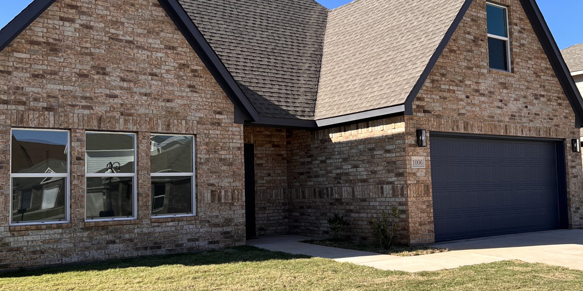 A brick home in the Courts of Montevino neighborhood. Homes in this subdivision were built using loans from the Oklahoma Housing Stability Program.